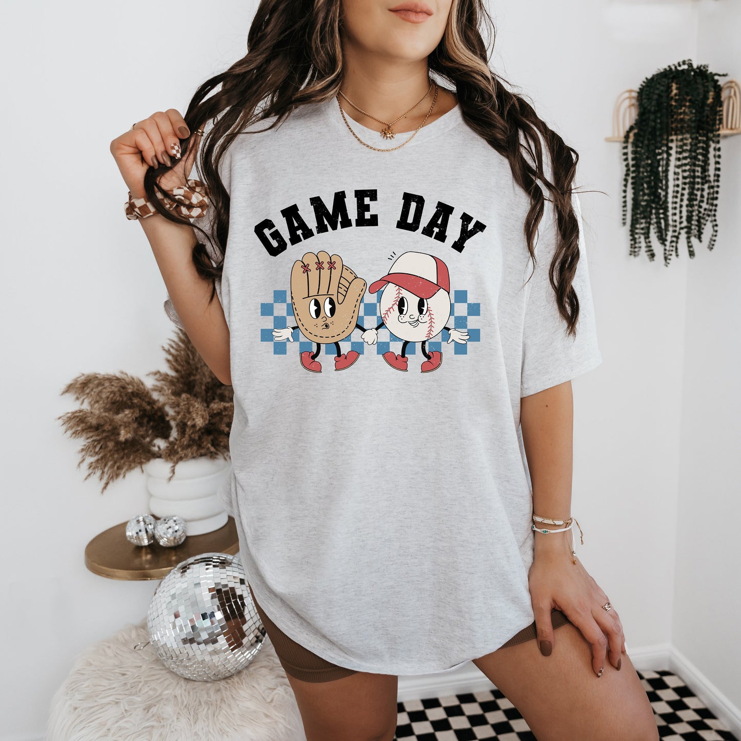 a woman wearing a t - shirt that says game day
