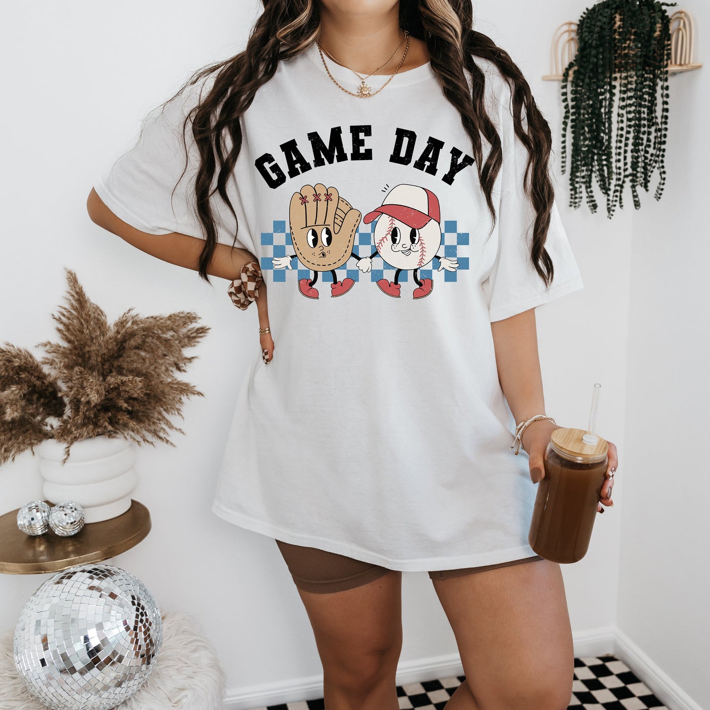 a woman with long hair wearing a game day shirt