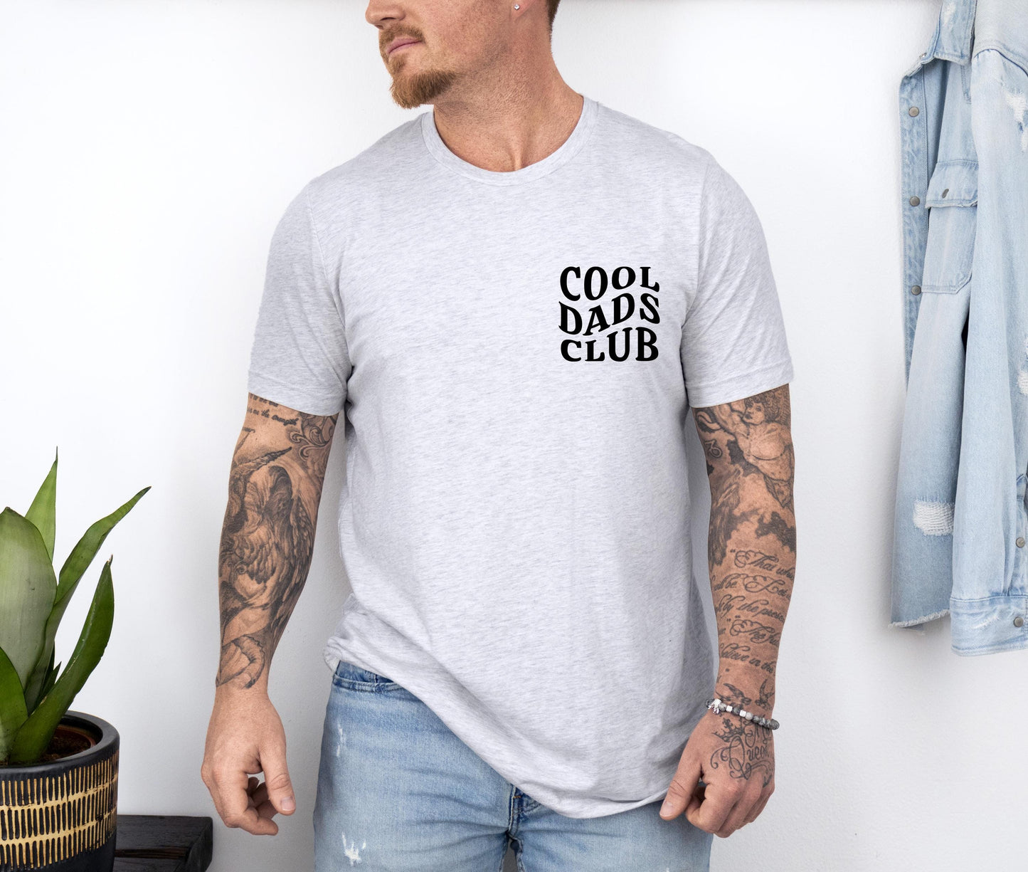 a man wearing a cool dads club t - shirt