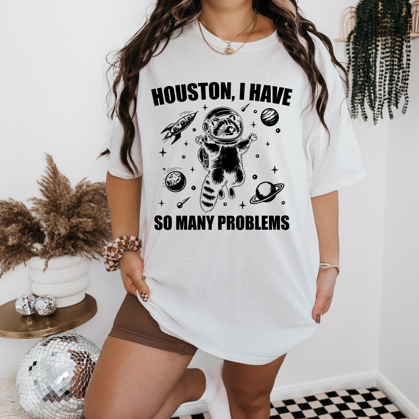 a woman wearing a houston i have so many problems t - shirt