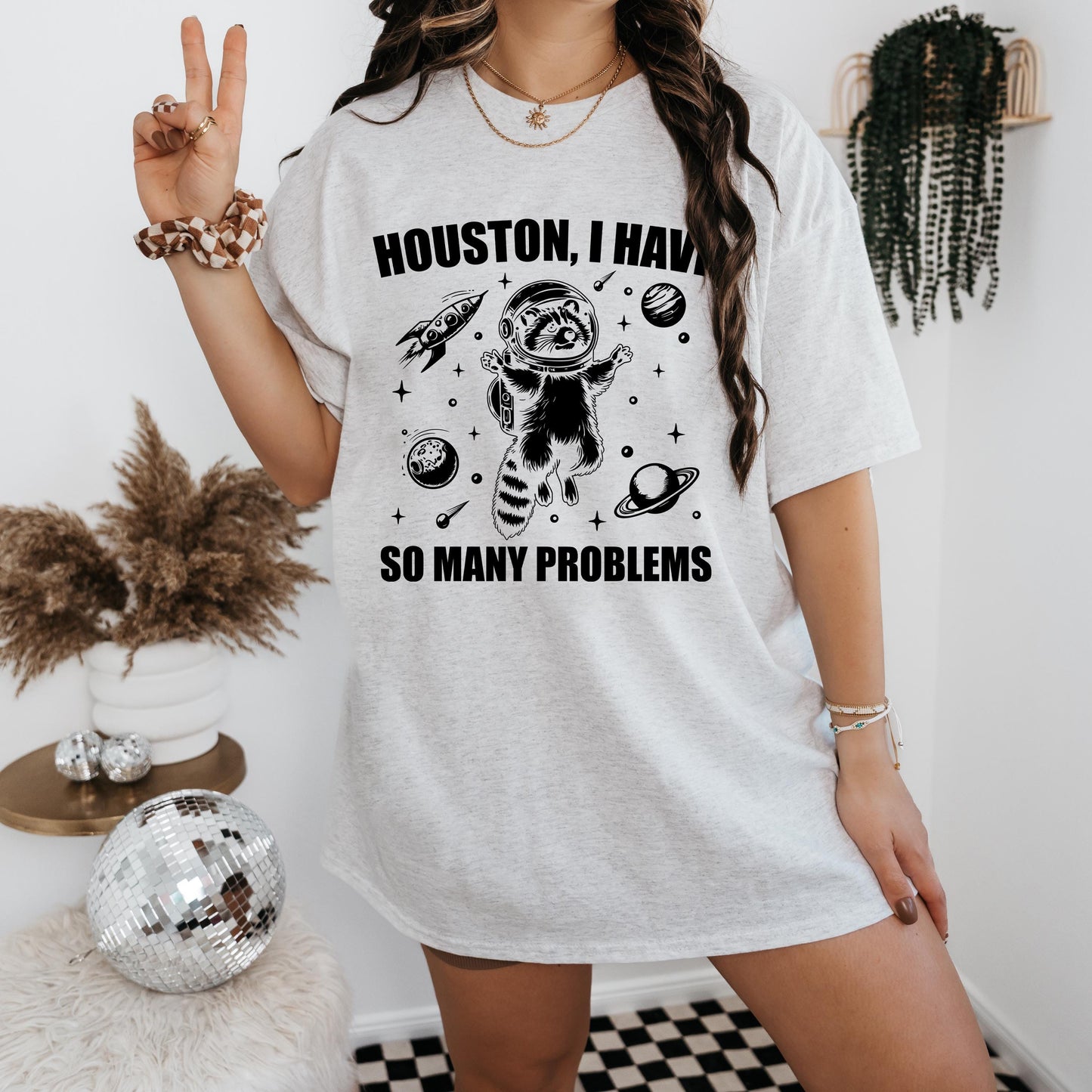 a woman wearing a houston i have so many problems shirt