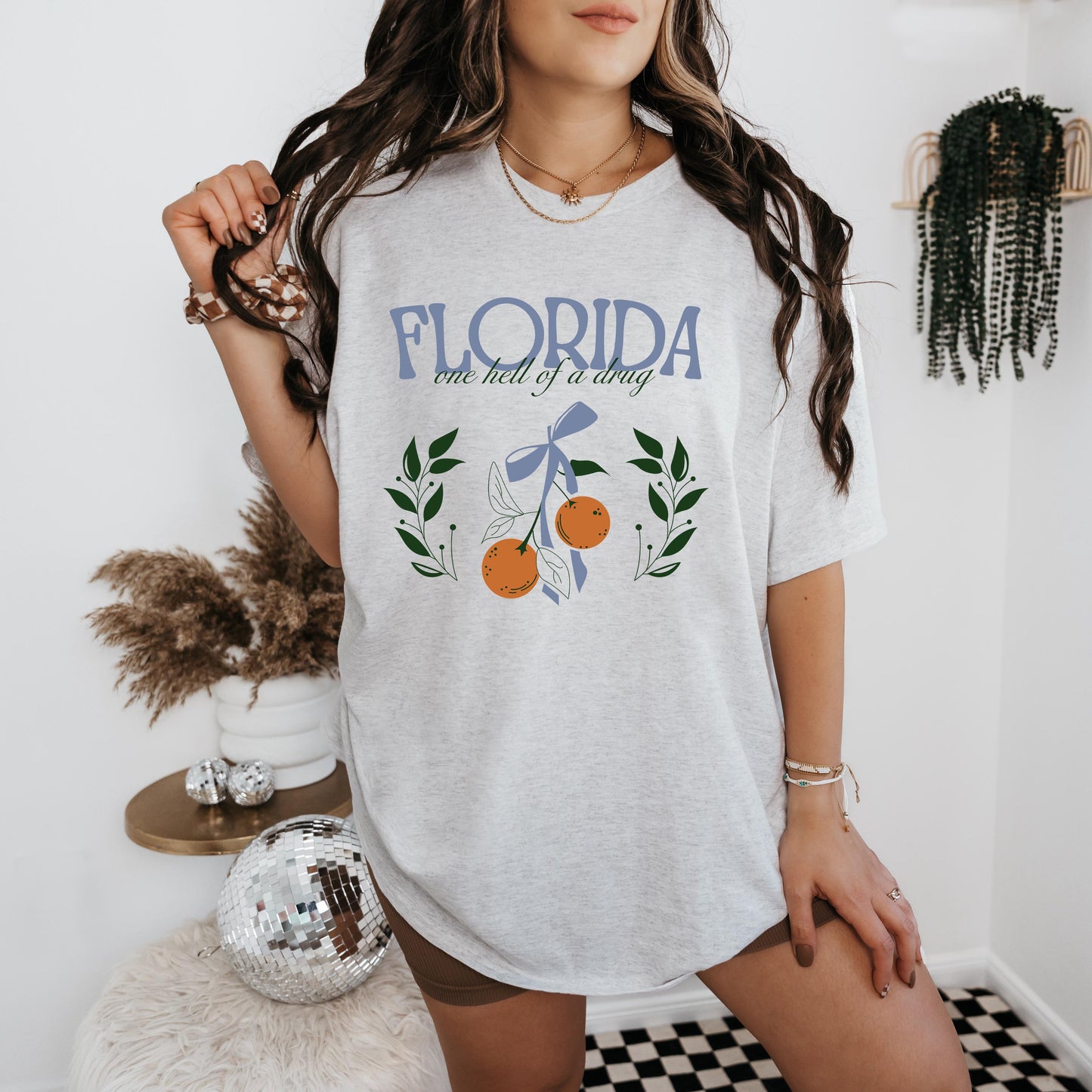 a woman in a florida t - shirt posing for a picture