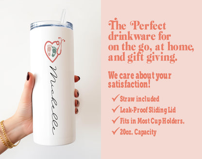a woman holding a white tumbler with a pink background