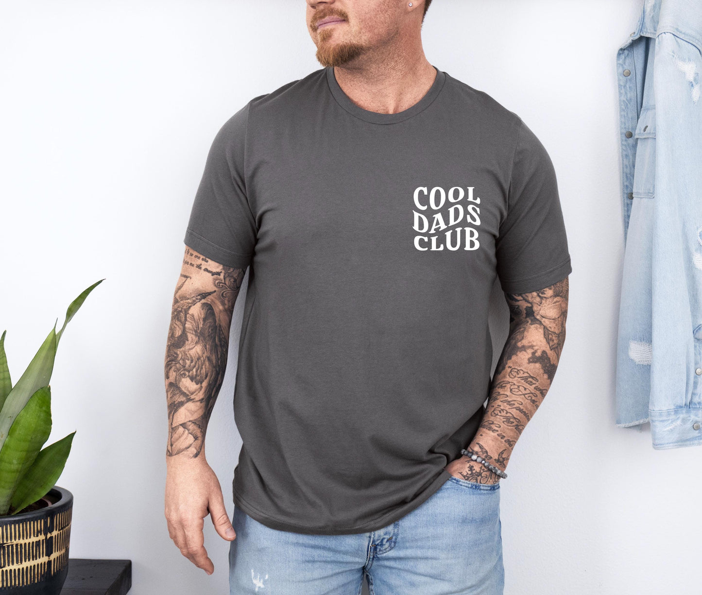 a man wearing a cool dad's club t - shirt