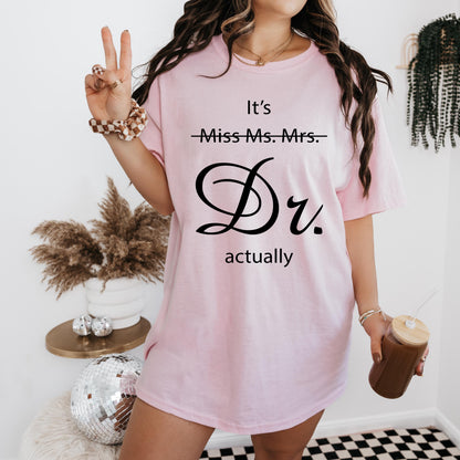 a woman wearing a pink t - shirt with the words it's miss mrs