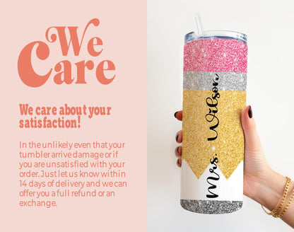 a woman holding a pink and gold glitter tumbler