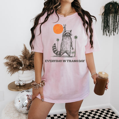 a woman in a pink shirt holding a cup of coffee