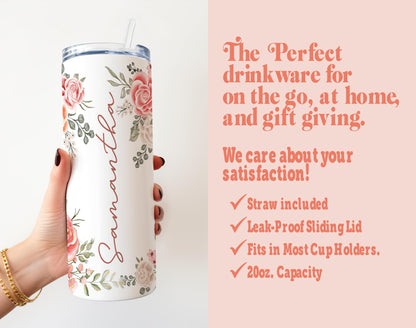 a woman holding a white tumbler with pink flowers on it