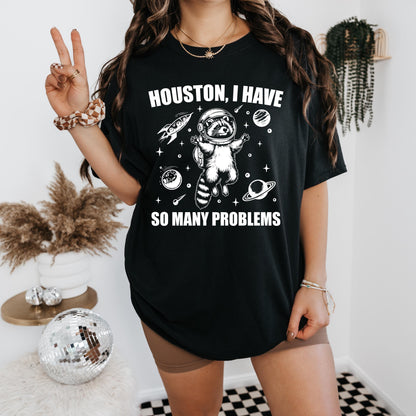 a woman wearing a houston i have so many problems shirt