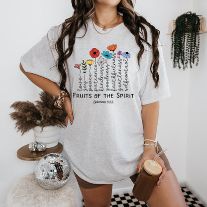 a woman standing in a room holding a cup of coffee
